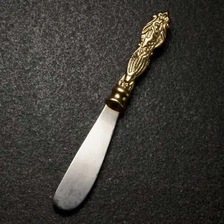 Alum Gilded Fleur de lis Spreader